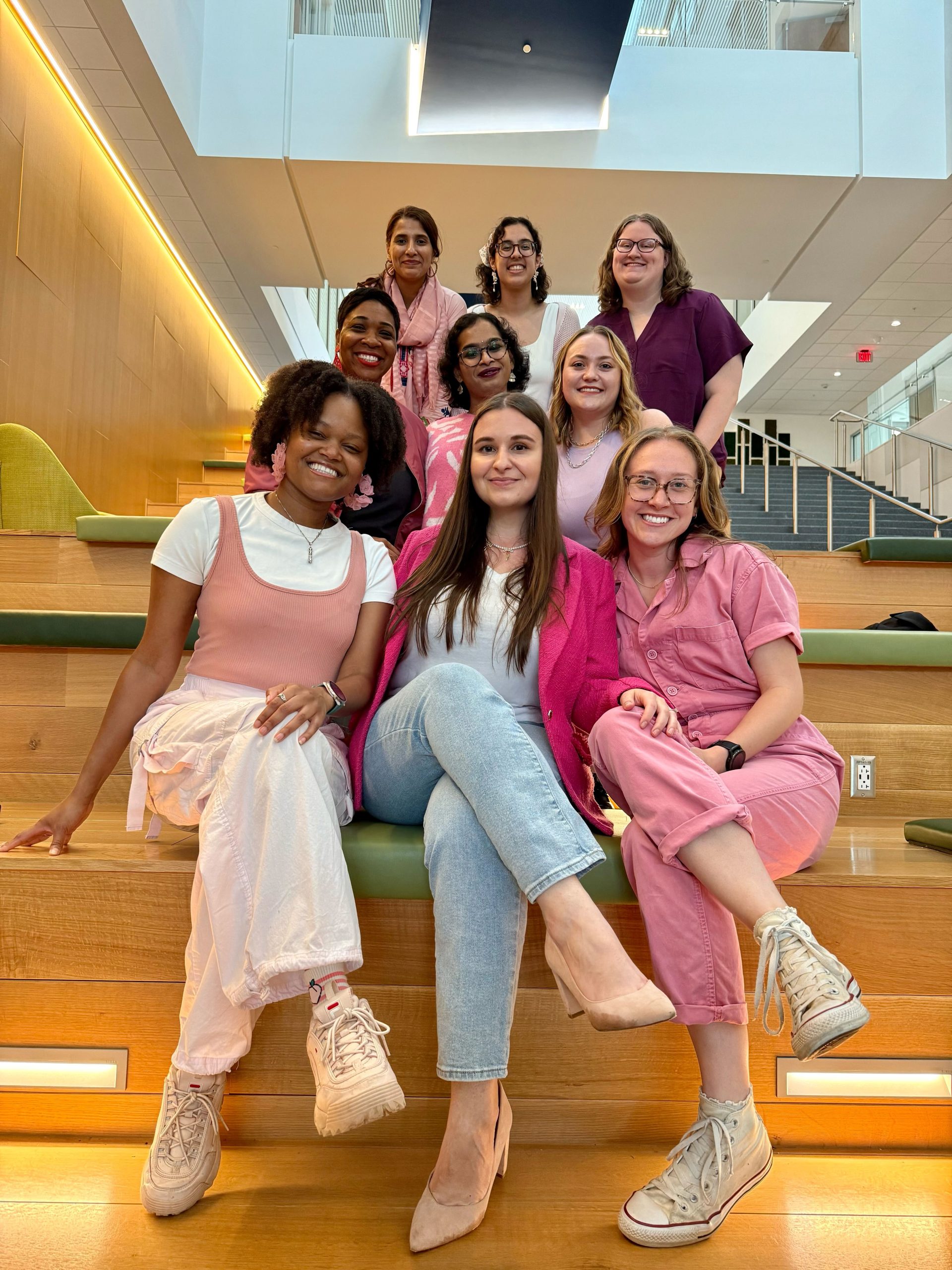 Members of the Popova Research Group posing for a photo sitting on stairs