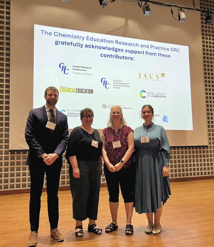 Jordan Harshman, Elizabeth Yuriev, Renée Cole and Maia Popova on the GRC stage